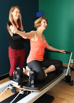 Susan Beth teaching Pilates